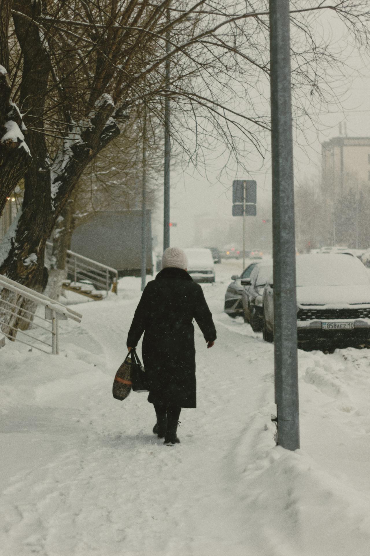 A person walking on a snowy path | Source: Pexels