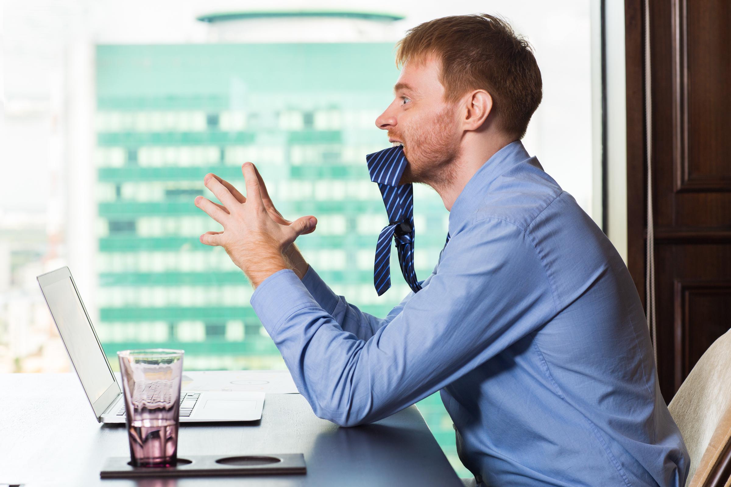 A stressed man in his office | Source: Freepik