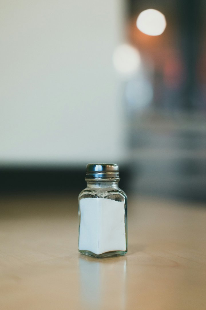 A salt shaker on a table | Source: Unsplash