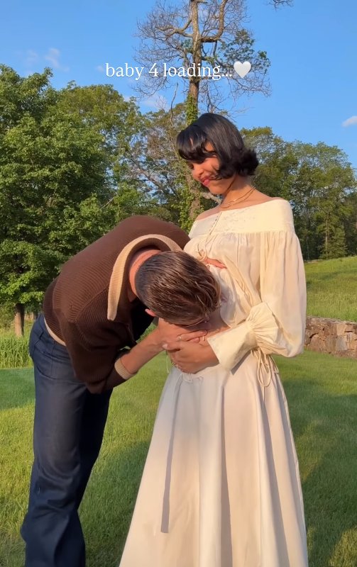 Lucky Blue Smith kisses Nara's belly as they celebrate their expanding family, June 8, 2025 | Source: Instagram/naraaziza