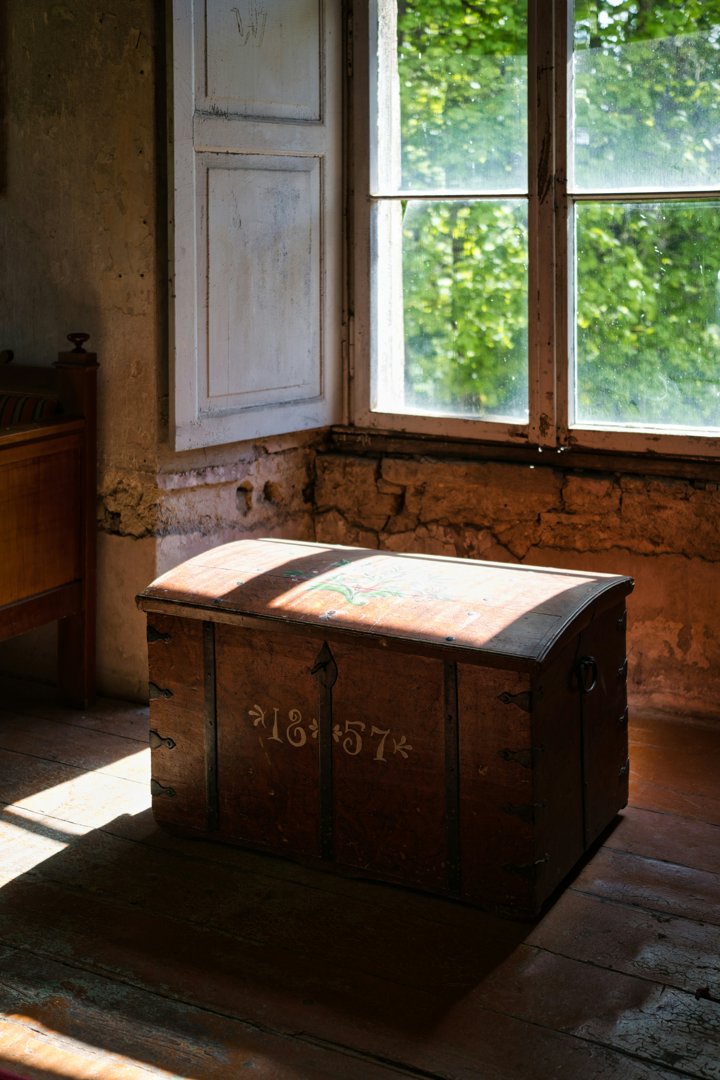 An antique box near a window | Source: Unsplash