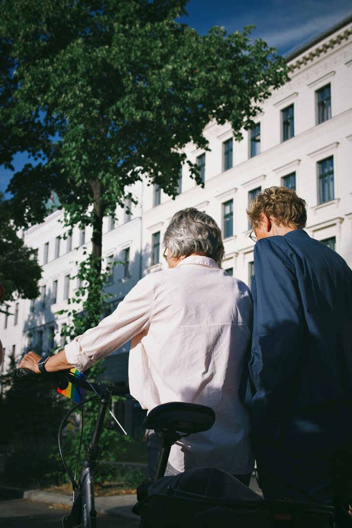 Senior woman with a young man walking down the street | Source: Unsplash