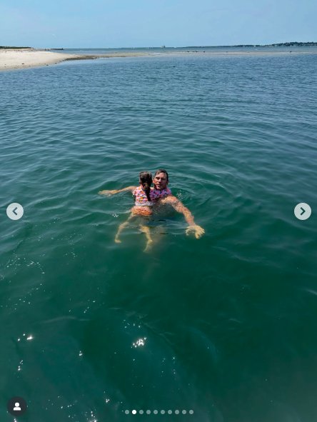 Chris Pratt swimming with one of his and Katherine Schwarzenegger's daughters, posted on August 23, 2025. | Source: Instagram/katherineschwarzenegger