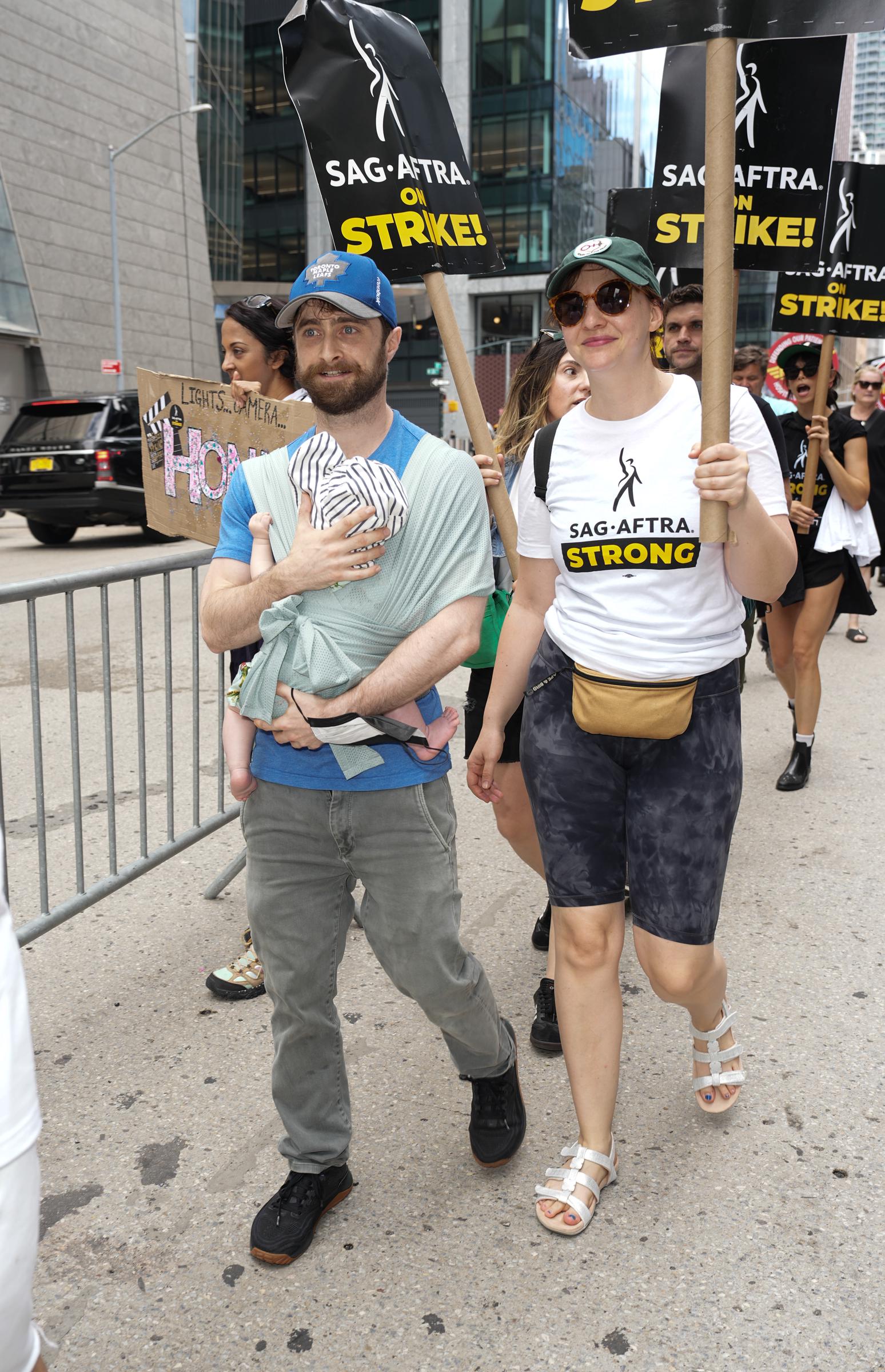 Daniel Radcliffe and Erin Darke join the picket line in New York on July 21, 2023. | Source: Getty Images