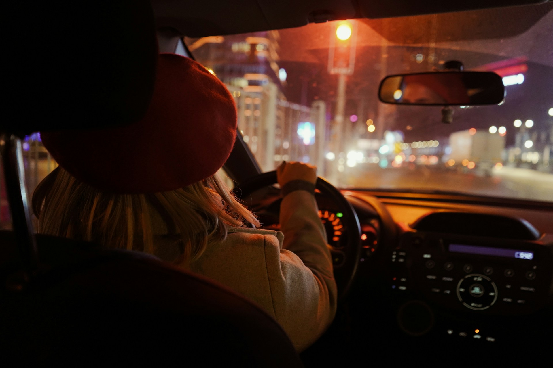 A woman driving a car at night | Source: Unsplash