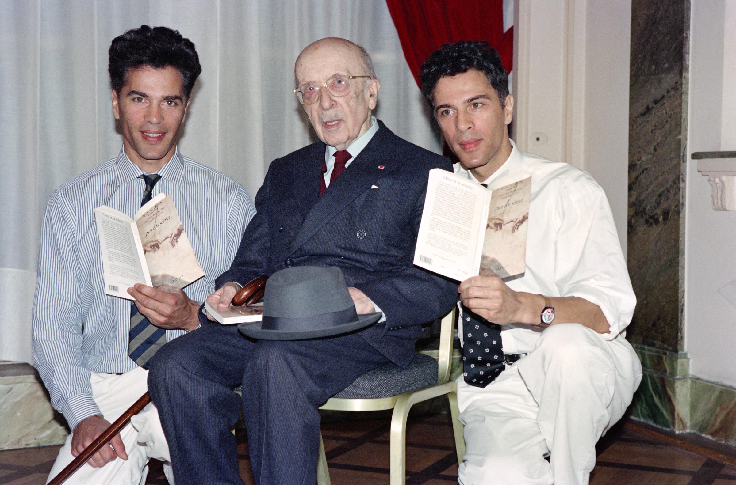 French writer and academician Jean Guitton (center) is pictured with French scientific journalists Igor (left) and Grichka Bogdanoff (right), his co-authors of