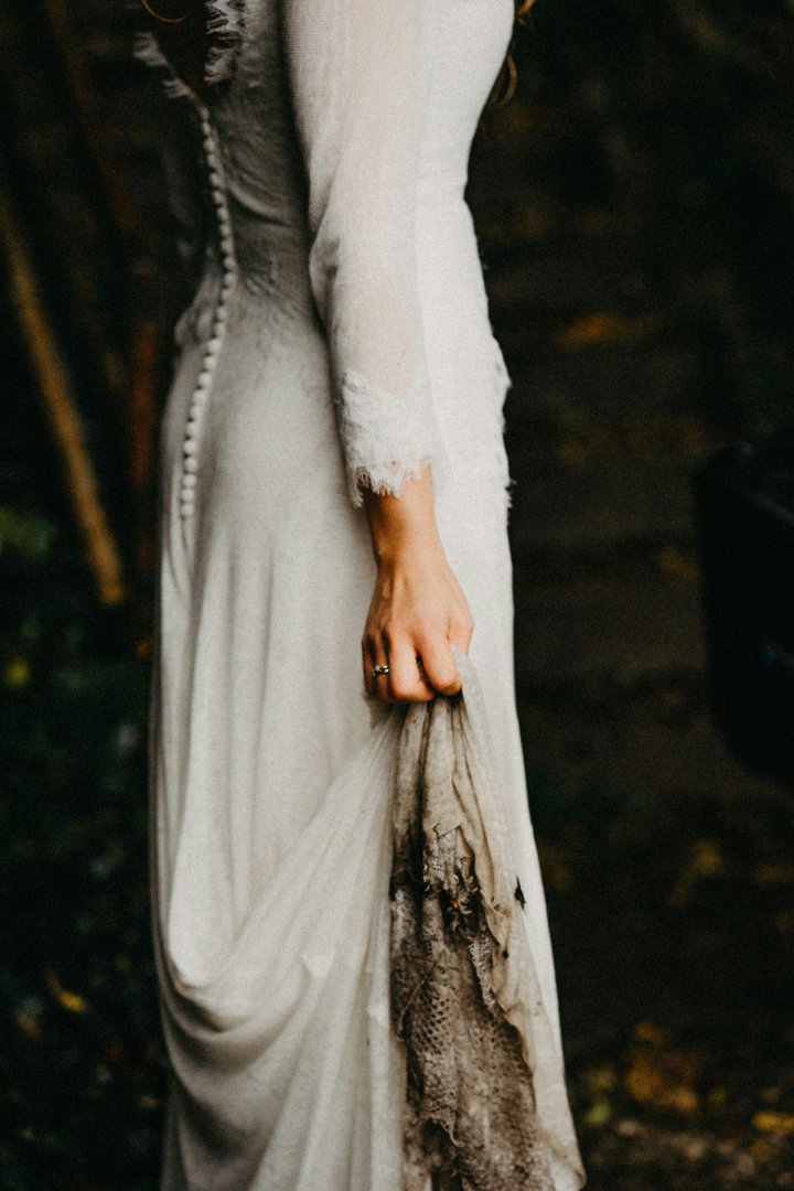 Woman wearing a stained wedding gown | Source: Unsplash