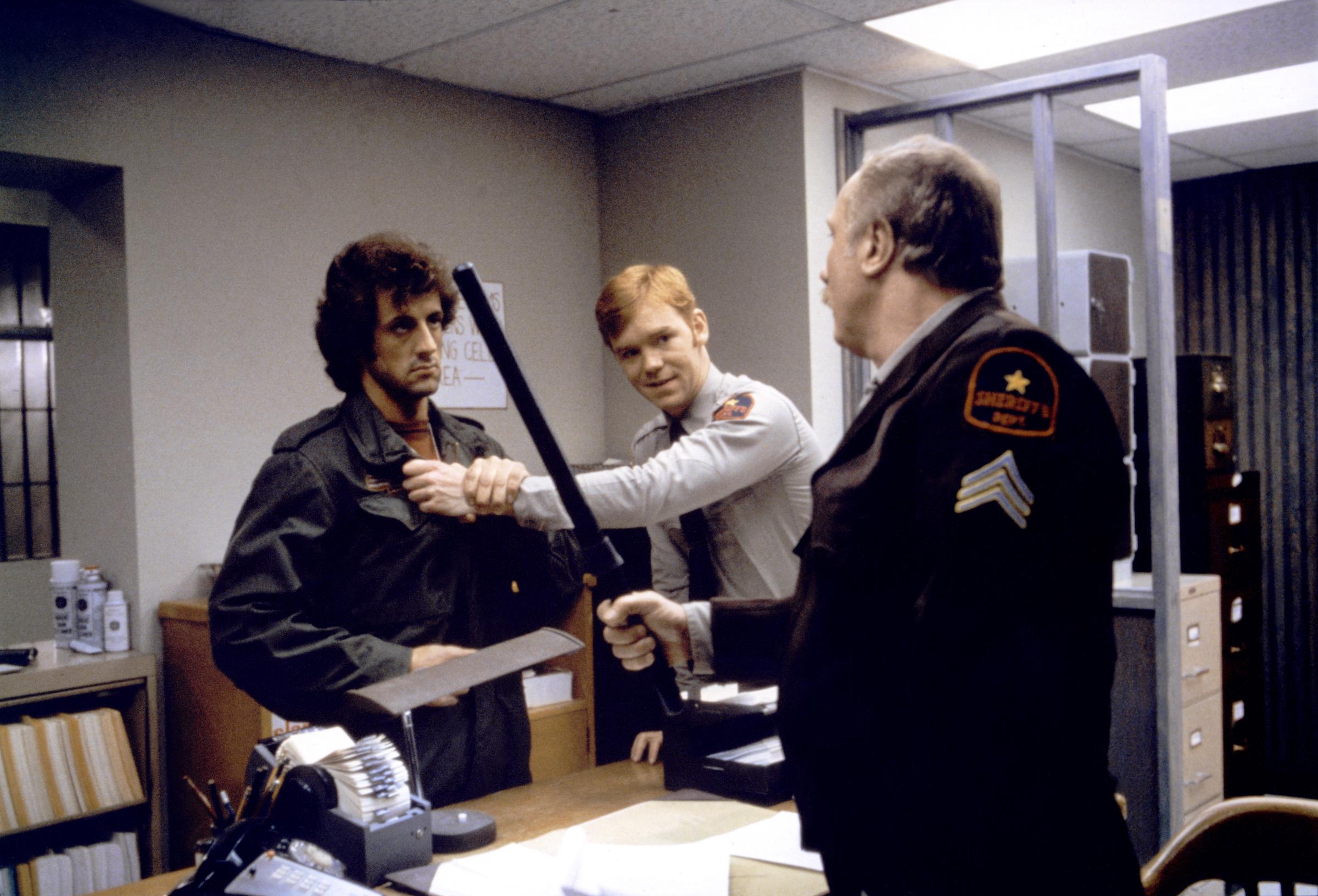 Sylvester Stallone as John Rambo and David Caruso as Deputy Mitch in