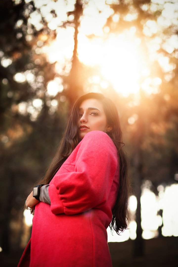 A woman wearing a red coat | Source: Unsplash