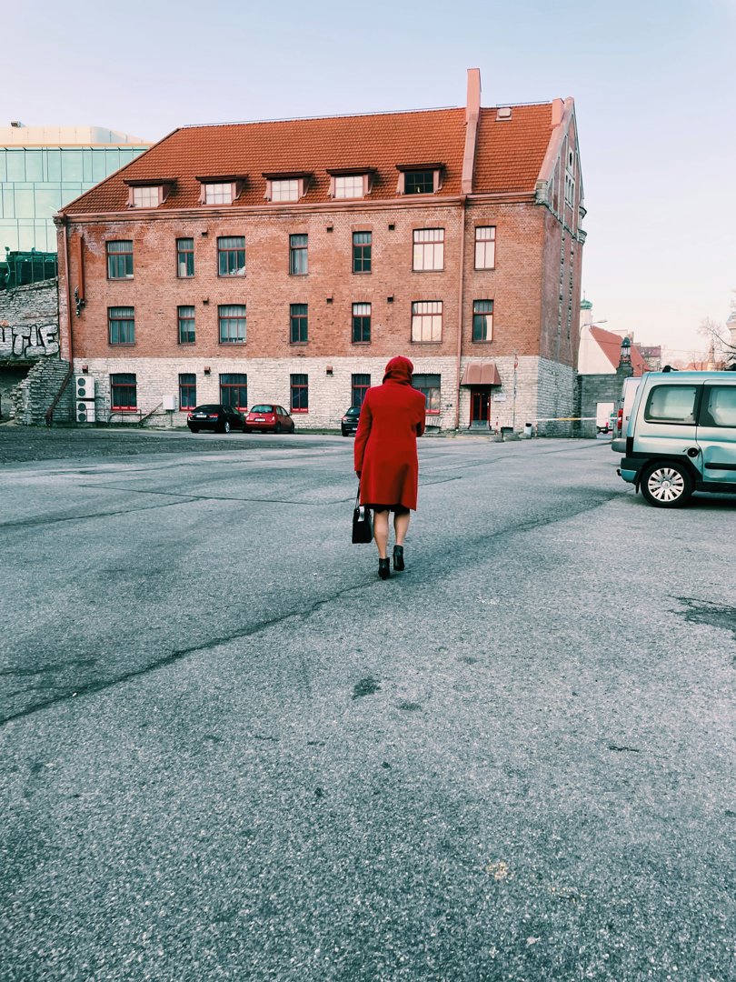 A woman walking in a parking lot | Source: Unsplash