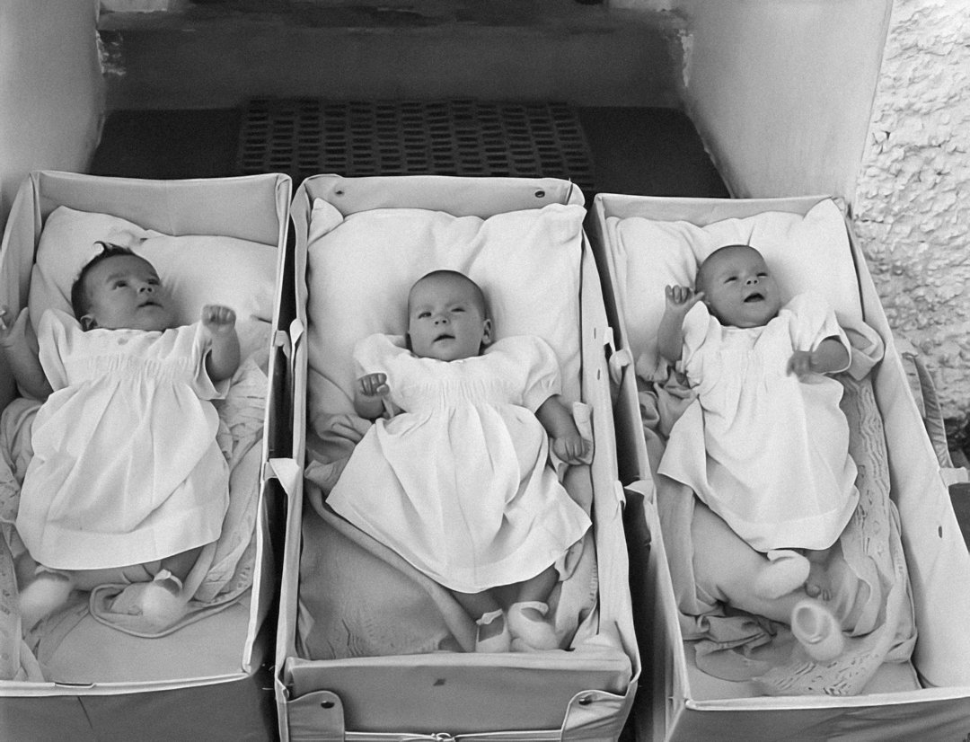 Triplet baby girls in cribs | Source: Unsplash