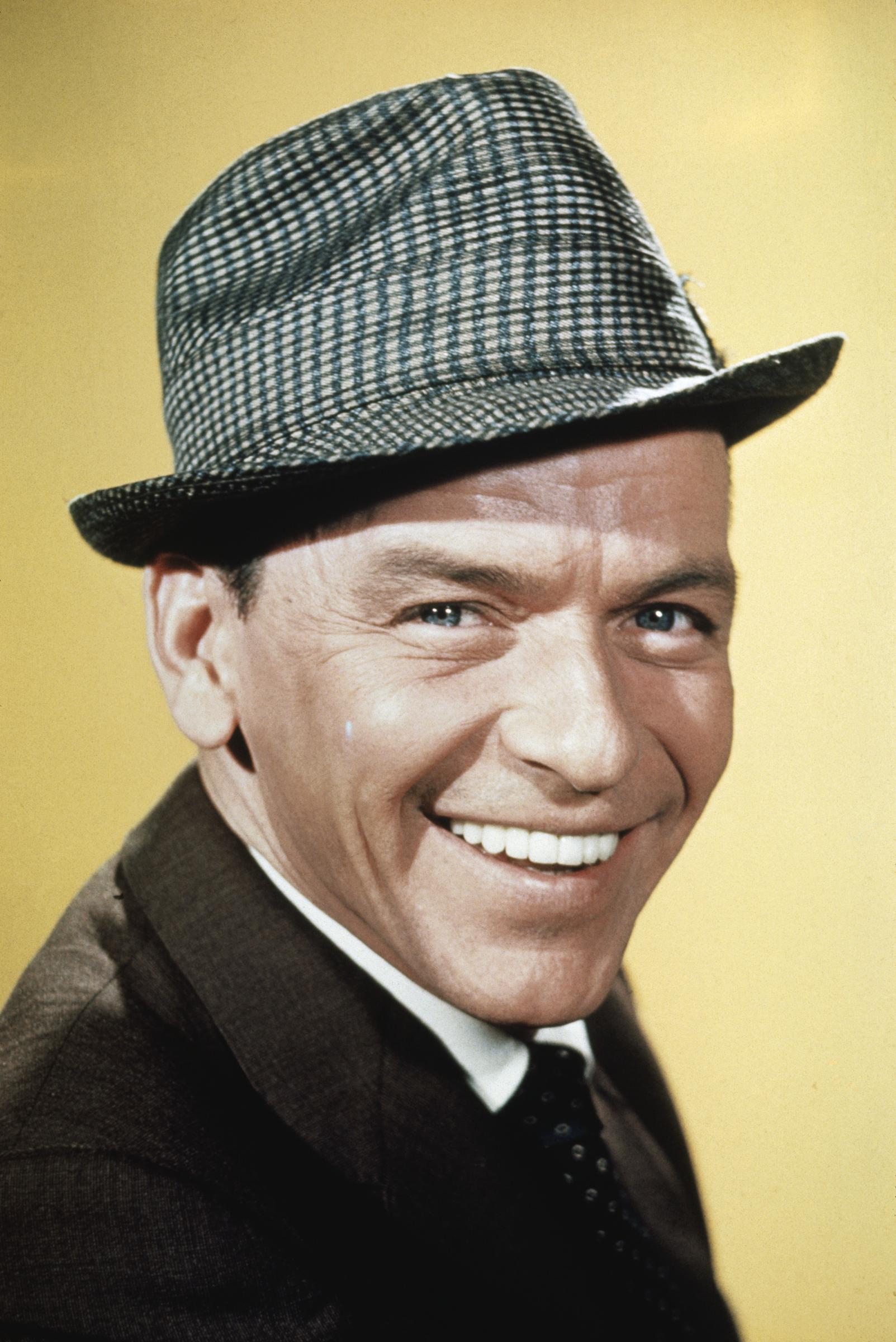 Frank Sinatra shown smiling in a close-up black-and-white photo, circa 1961 | Source: Getty Images