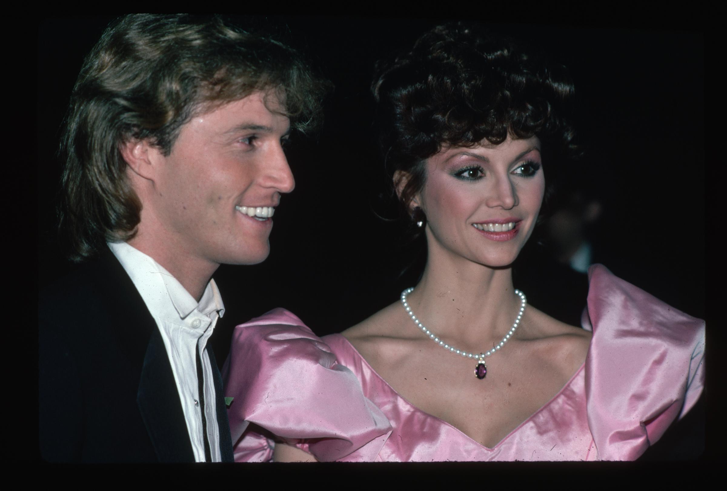 Andy Gibb and Victoria Principal posing together in 1981 | Source: Getty Images