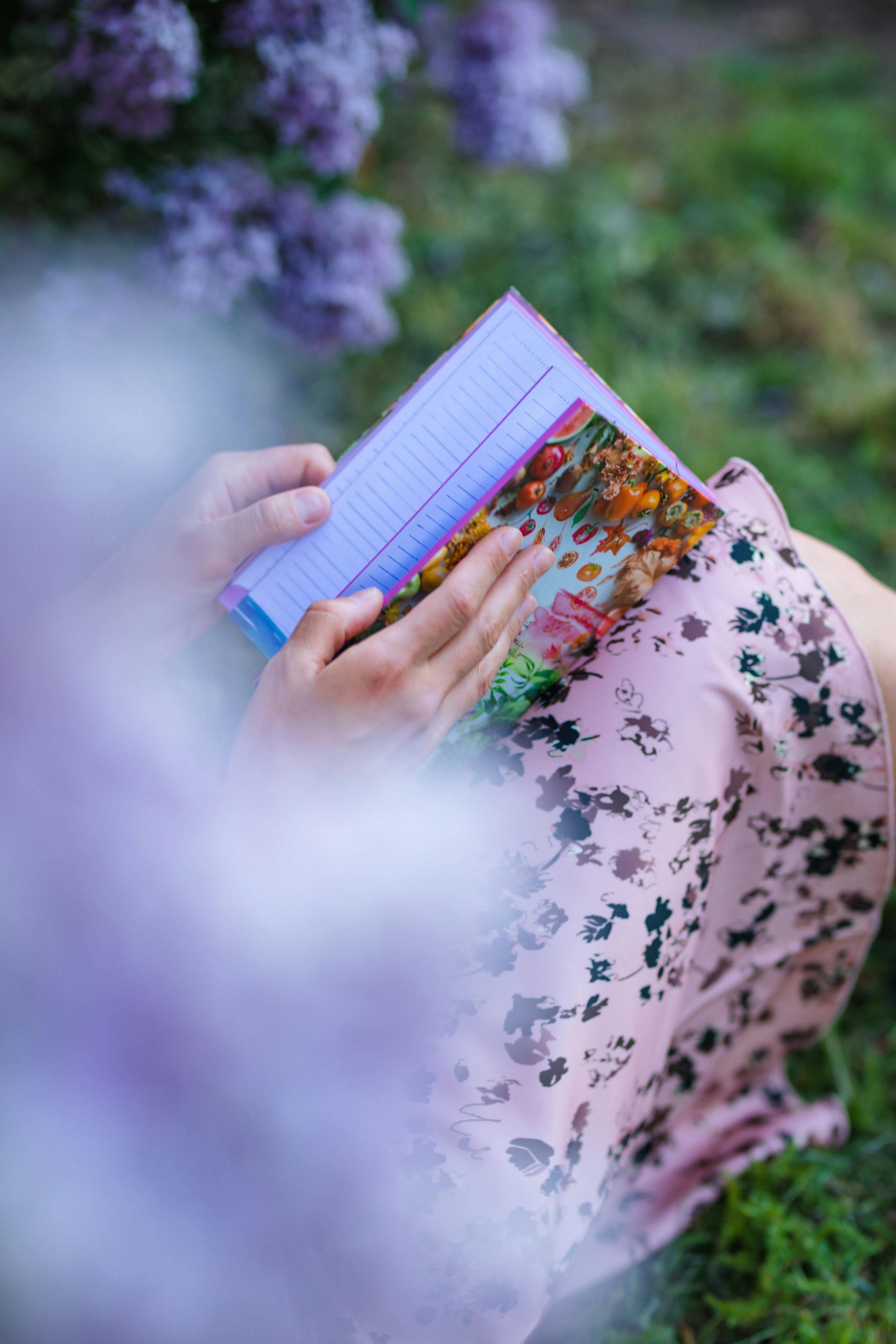 A woman holding a journal | Source: Pexels