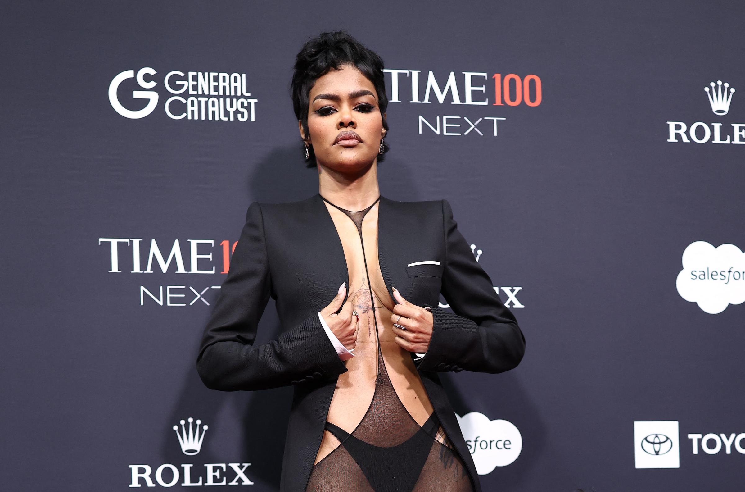 The star adjusting her blazer as she poses for the cameras. | Source: Getty Images