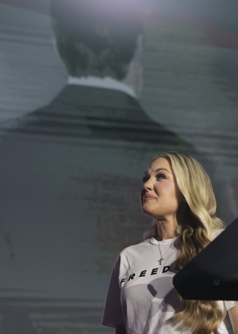 Erika Kirk reacts as a screen shows an image of her husband during the Turning Point USA event held at the University of Mississippi, in Oxford on October 29, 2025. | Source: Getty Images
