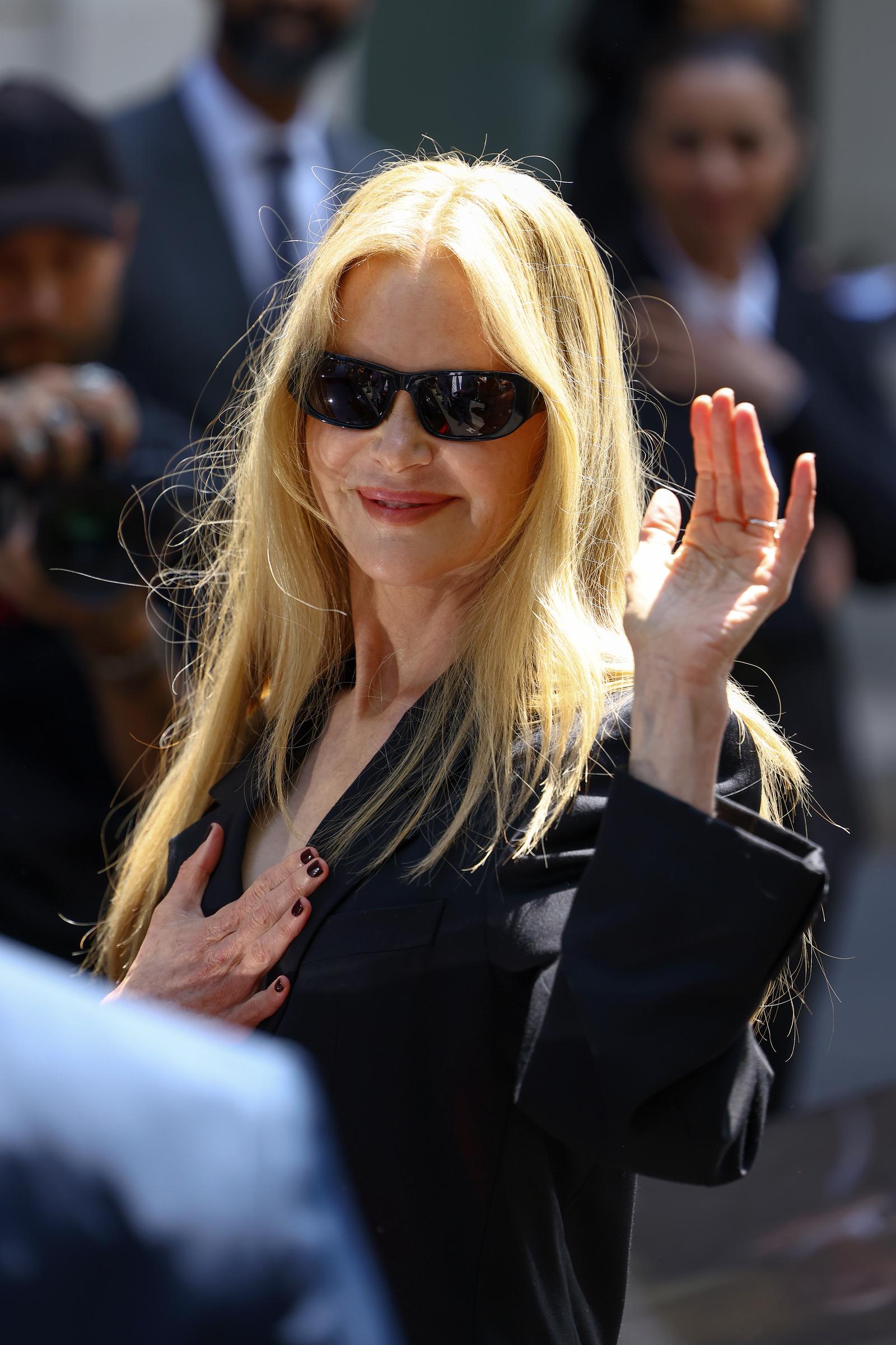 Nicole Kidman waves to the crowd at the Balenciaga Haute Couture Fall/Winter show. | Source: Getty Images