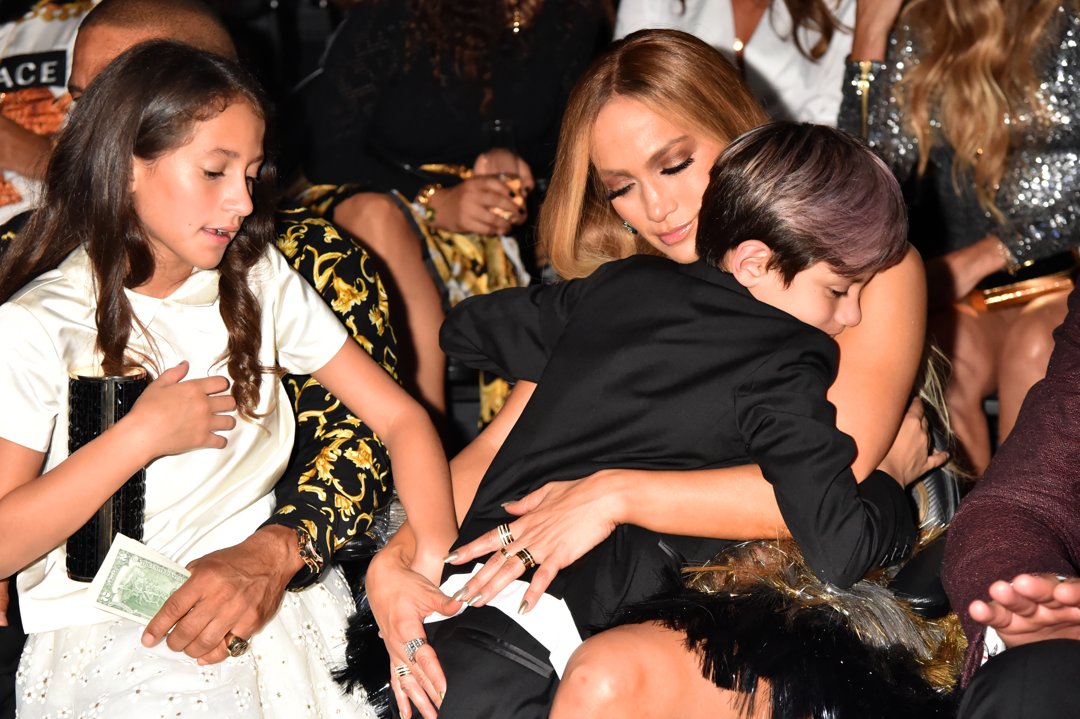 Jennifer Lopez shares a warm hug with Max while Emme is carried by an unseen celebrity at the MTV Video Music Awards at Radio City Music Hall in New York City. Even amid the glitz of a major event, Jennifer radiates her signature caring mom energy.