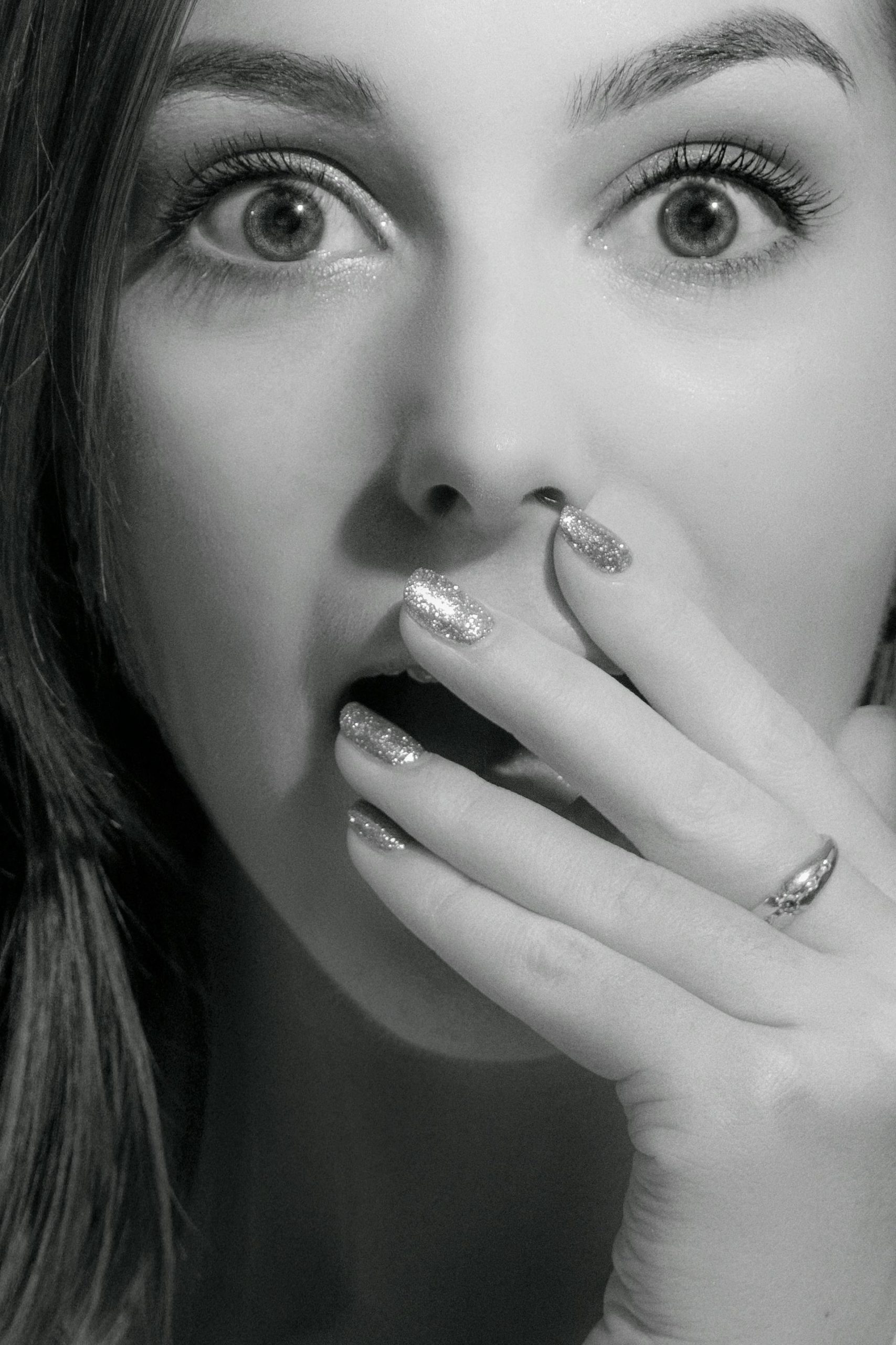 Grayscale shot of a startled woman | Source: Pexels
