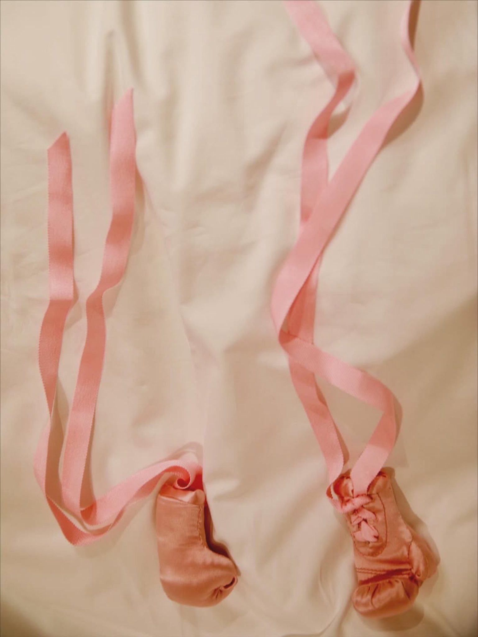 Rihanna shares a picture of tiny pink boxing gloves, posted on September 25, 2025. | Source: X/rihanna