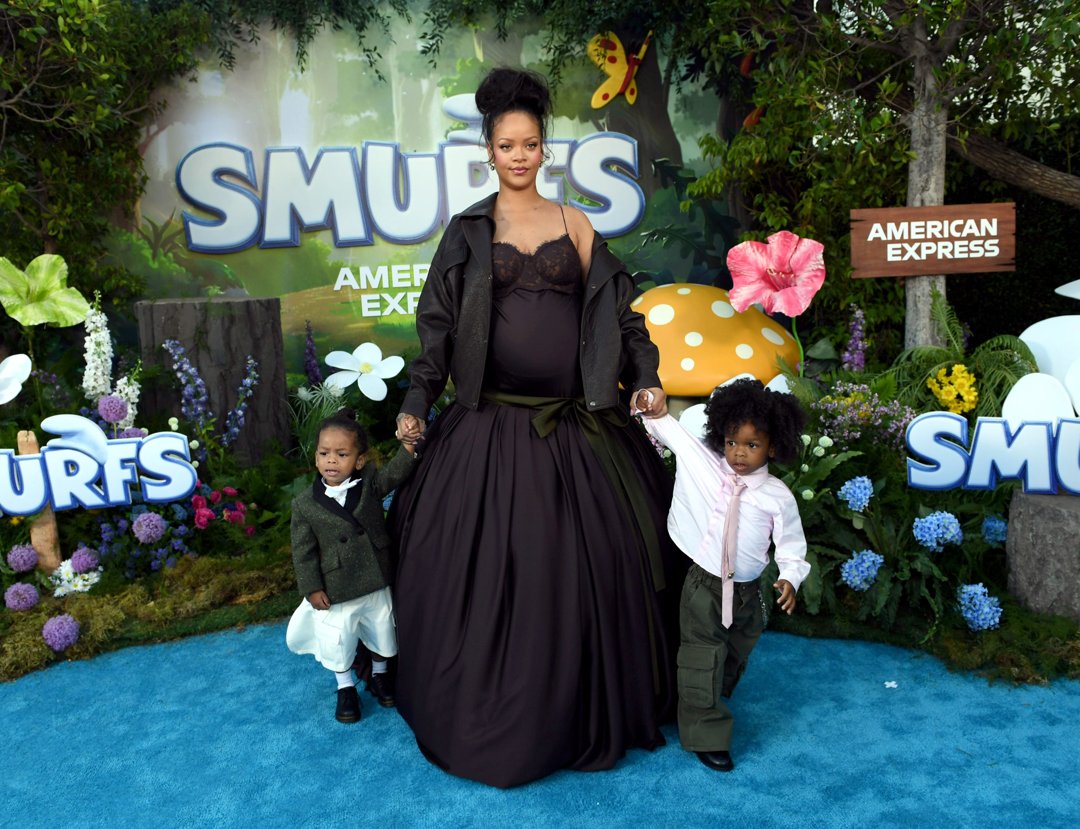 Rihanna holding hands with her sons Riot Rose Mayers and RZA Athelston Mayers at the Los Angeles premiere of ''Smurfs.