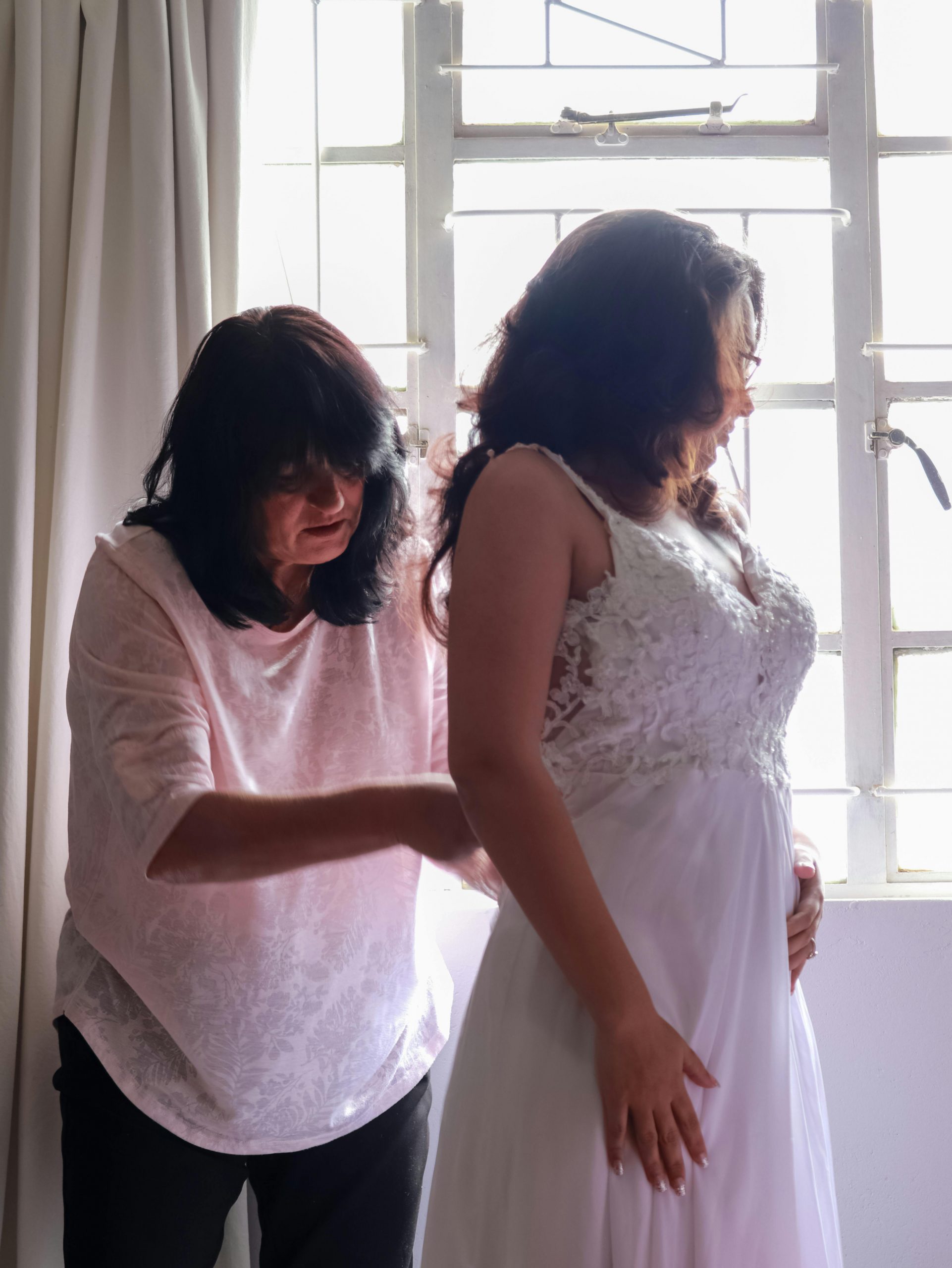 A bride getting fitted in her wedding dress | Source: Pexels