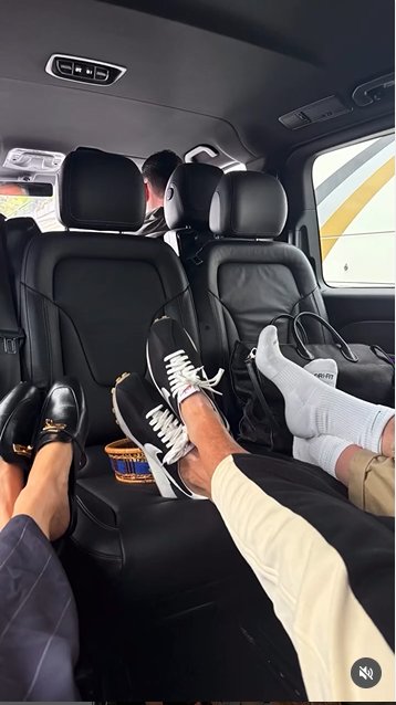 Meghan Markle's feet resting on the seat of the limo alongside the other occupants, from a post dated October 5, 2025 | Source: Instagram/meghan