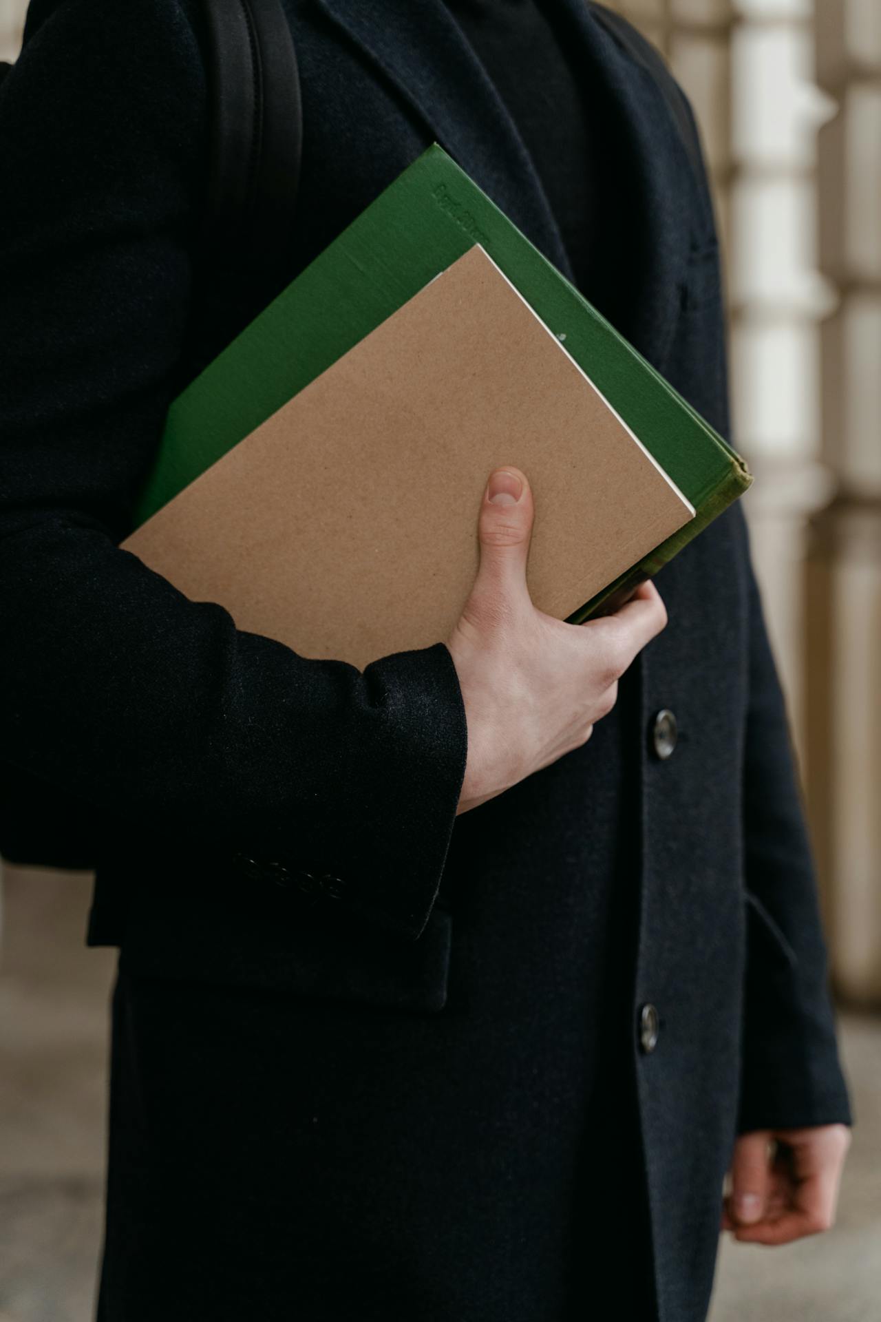 A person holding folders | Source: Pexels