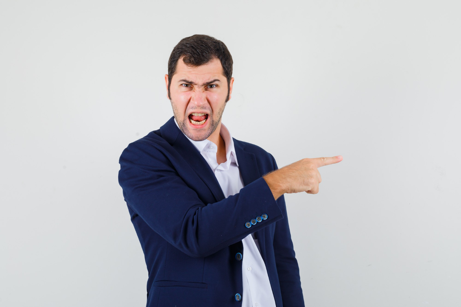An angry man pointing his finger | Source: Freepik
