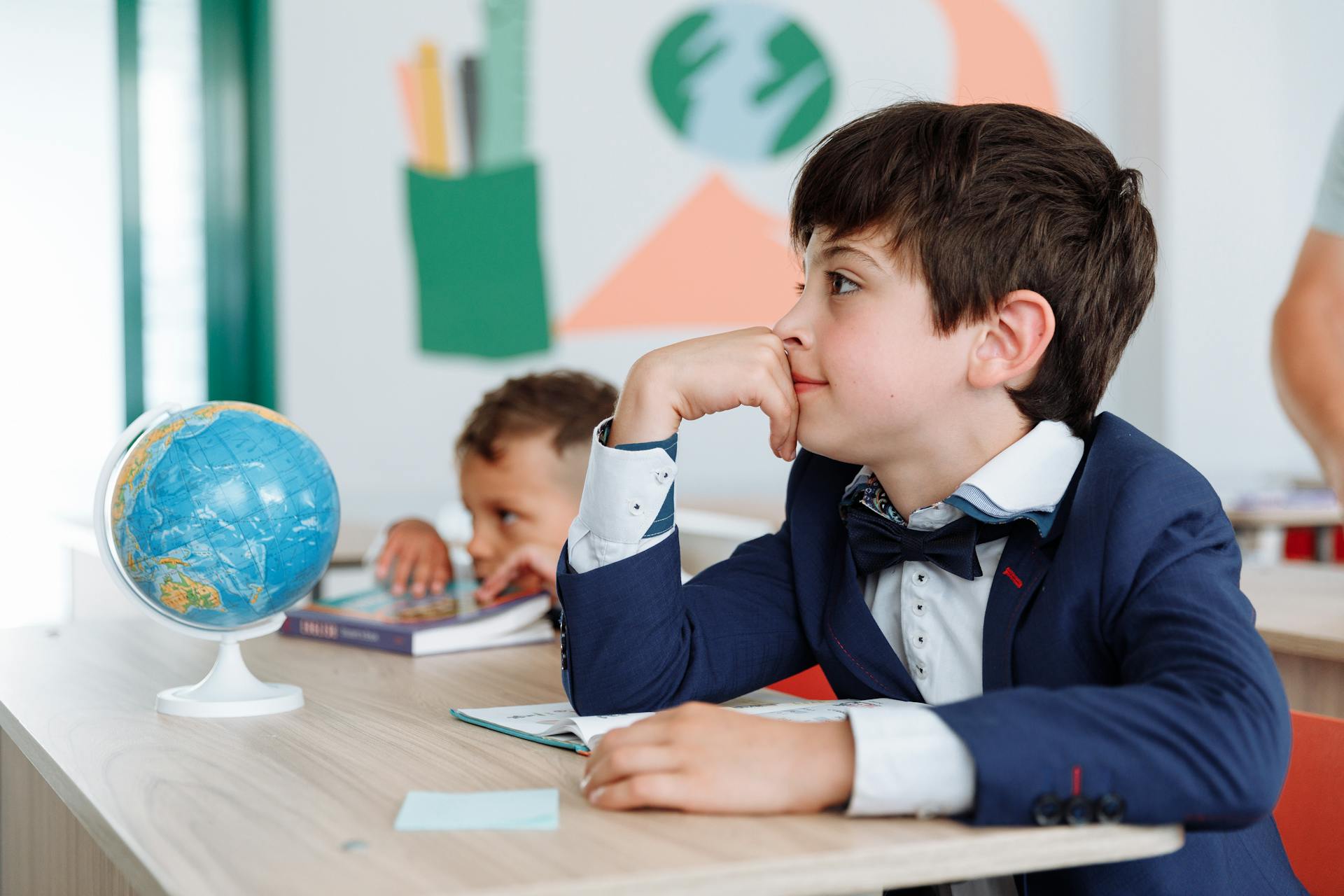 Boys sitting in a classroom | Source: Pexels