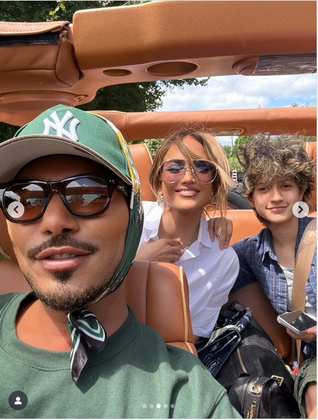Jennifer Lopez and Emme Muñiz posing for a photo with someone else. | Source: Instagram/jlo