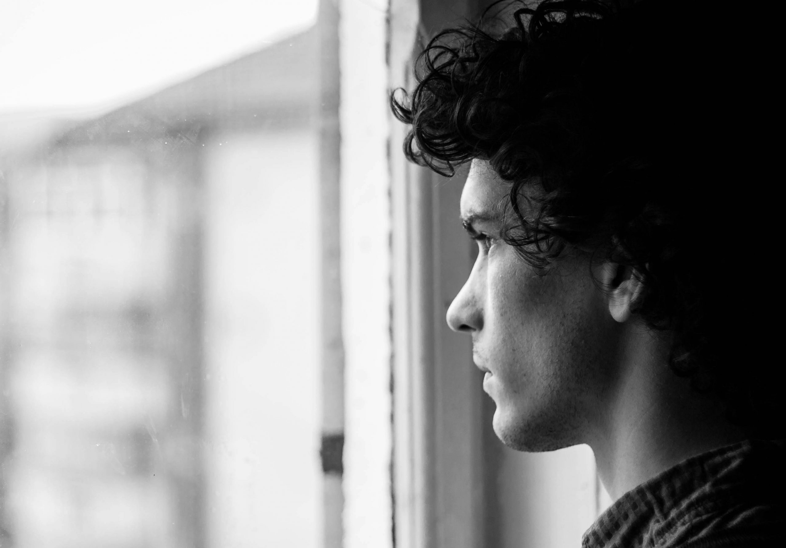 A man looking outside a window | Source: Pexels