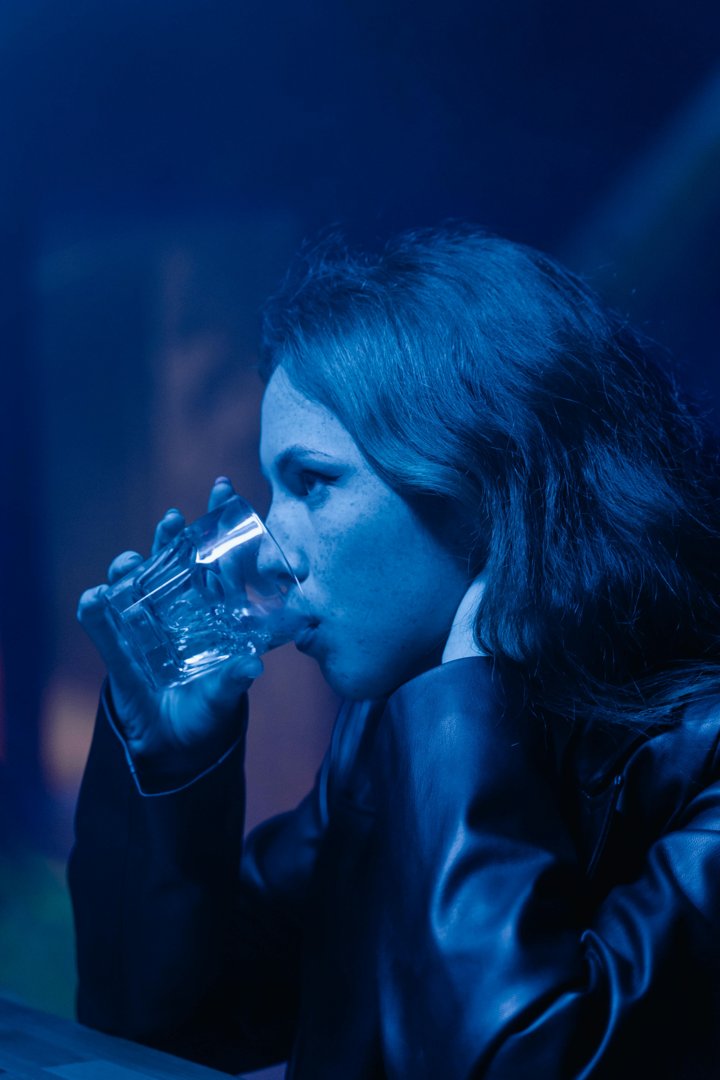 A woman drinking something | Source: Pexels