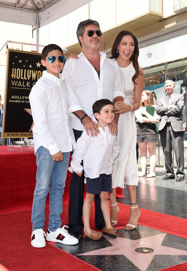 Lauren Silverman, with her sons Eric and Adam, attends Simon Cowell's Hollywood Walk of Fame ceremony on August 22, 2018 | Source: Getty Images