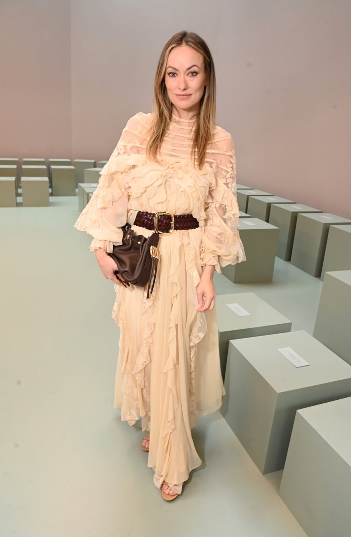 Olivia Wilde attended the Zimmermann show at Paris Fashion Week Women’s Spring/Summer 2026 in France, looking glamorous in a cream ruffled dress cinched at the waist with a brown leather belt. She styled the look with a slouchy brown leather clutch and natural hair and make-up.