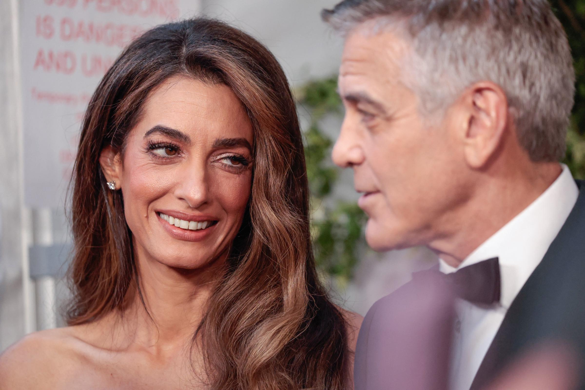 Amal looks at her husband, George Clooney, as they attend the 78th Tony Awards at Radio City Music Hall in New York, on June 8, 2025 | Source: Getty Images