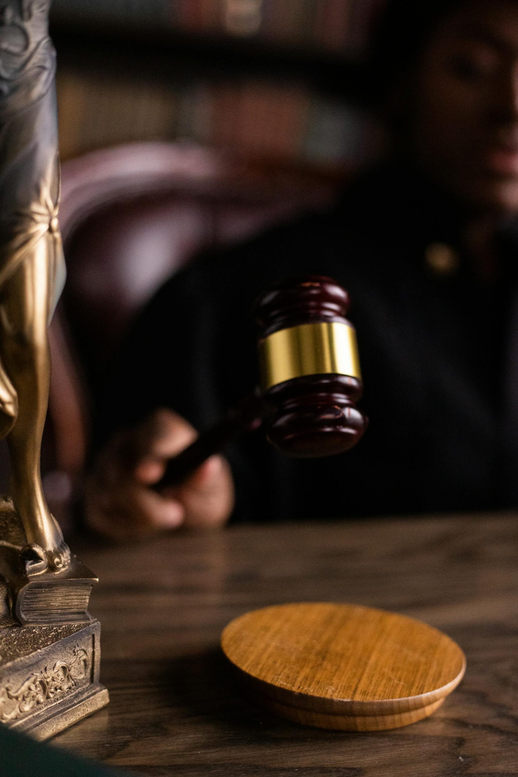 A judge holding a wooden gavel | Source: Pexels