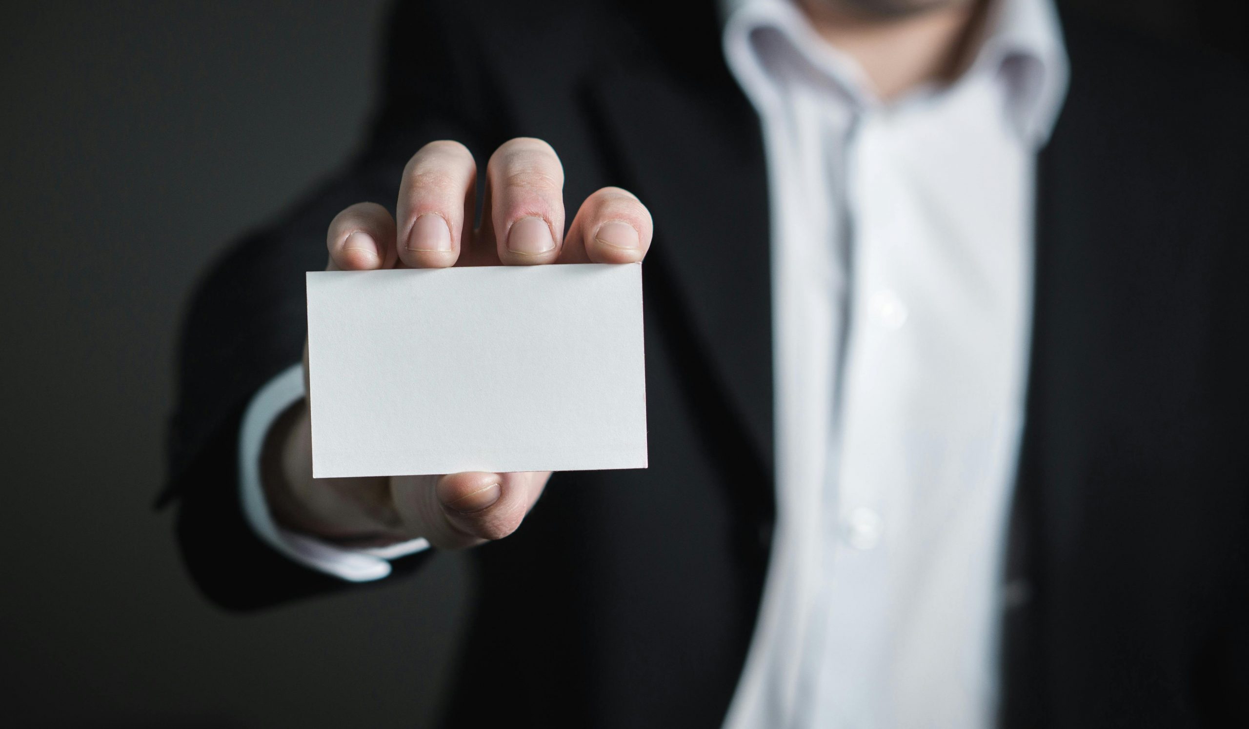 A man holding a business card | Source: Pexels