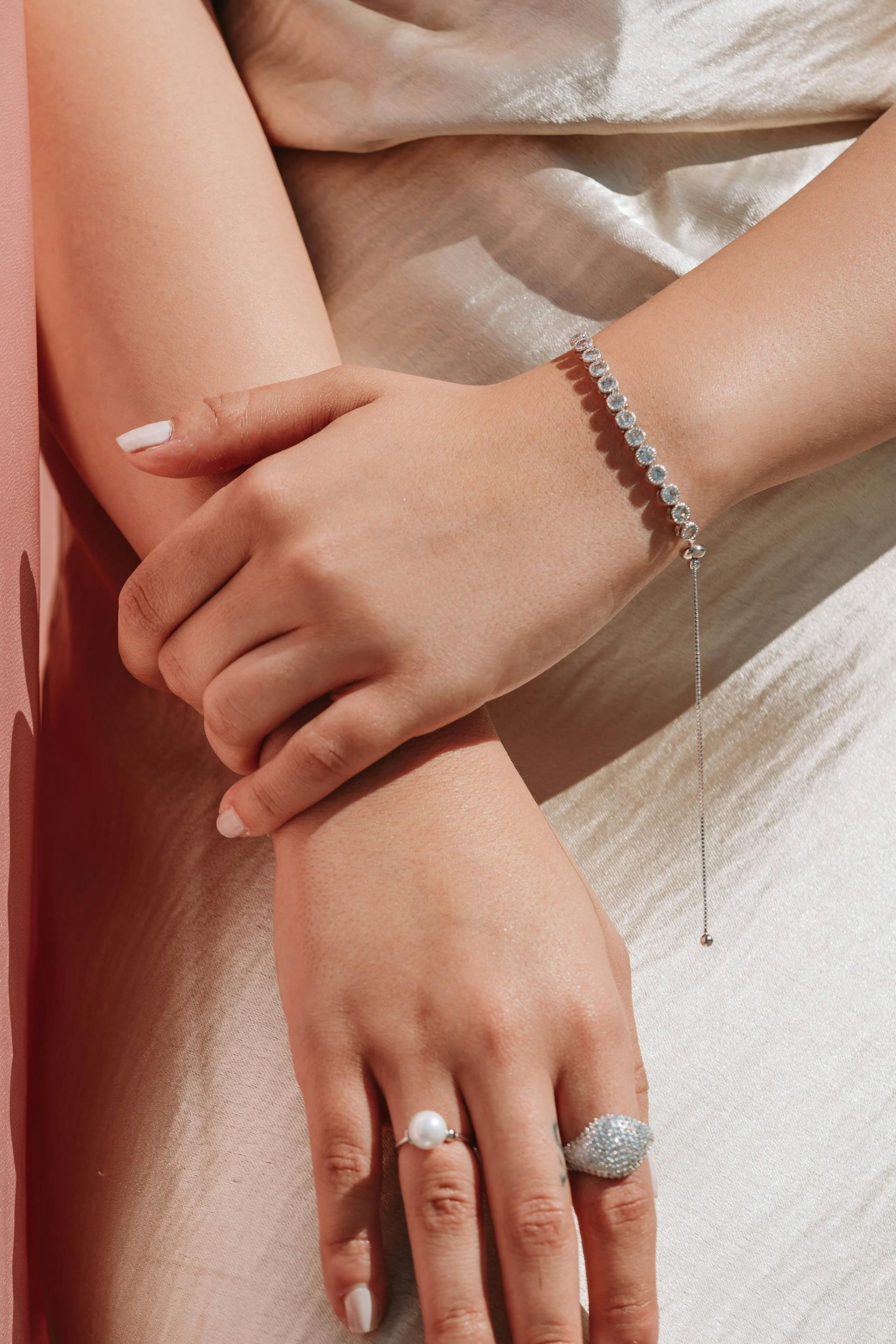 A close-up shot of a woman wearing a bracelet and rings | Source: Pexels