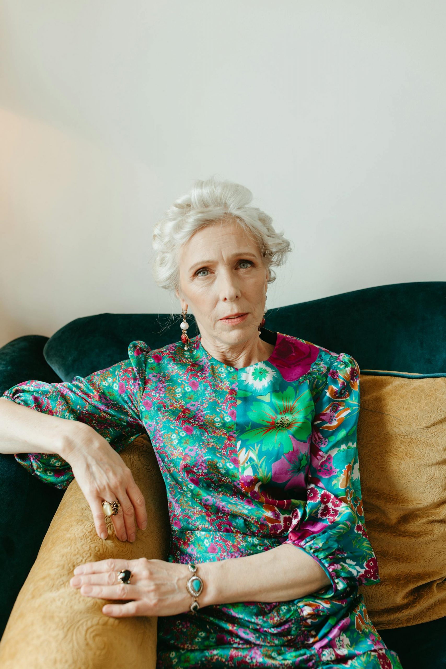 An elderly woman sitting on the couch and looking at someone | Source: Pexels