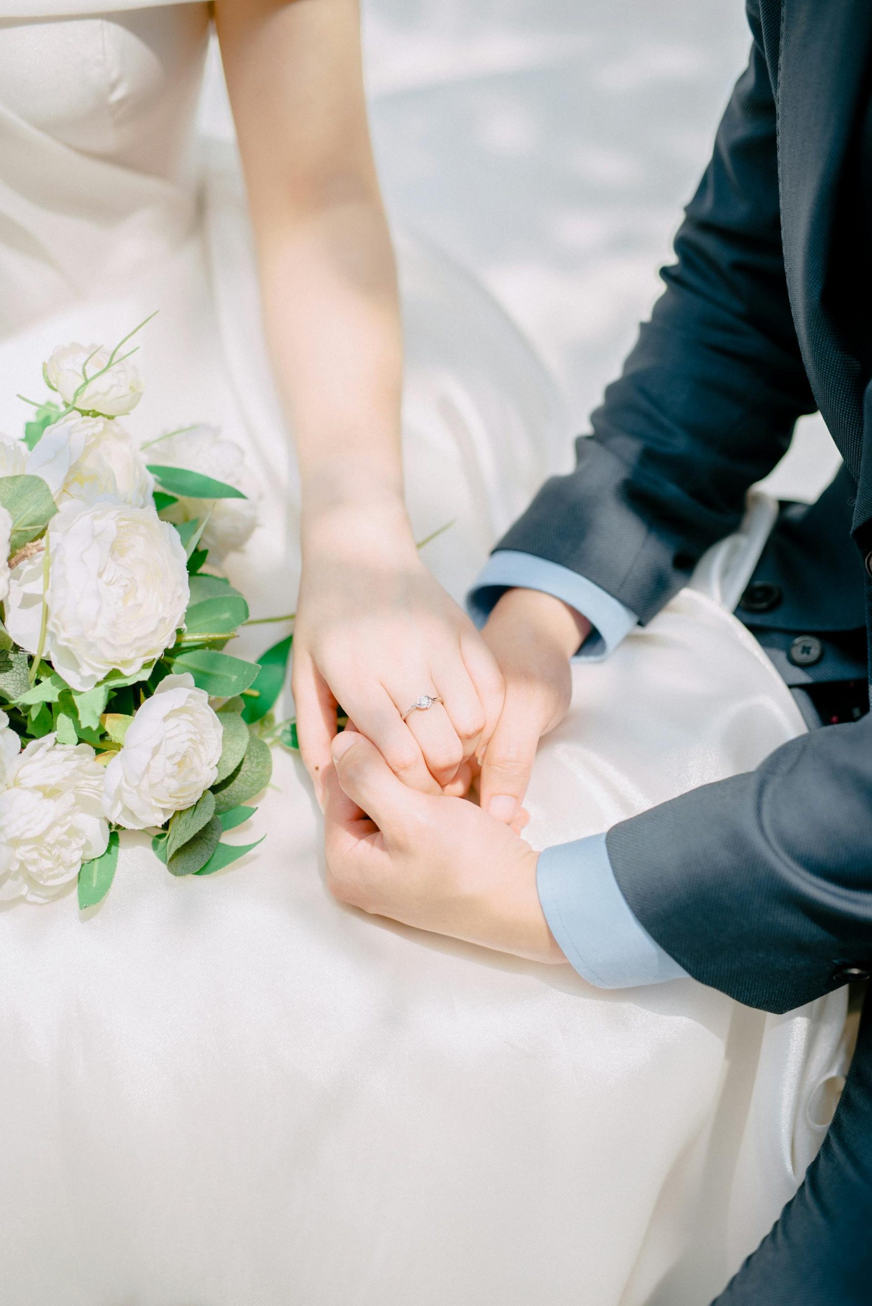 A close-up of newlyweds holding hands | Source: Pexels