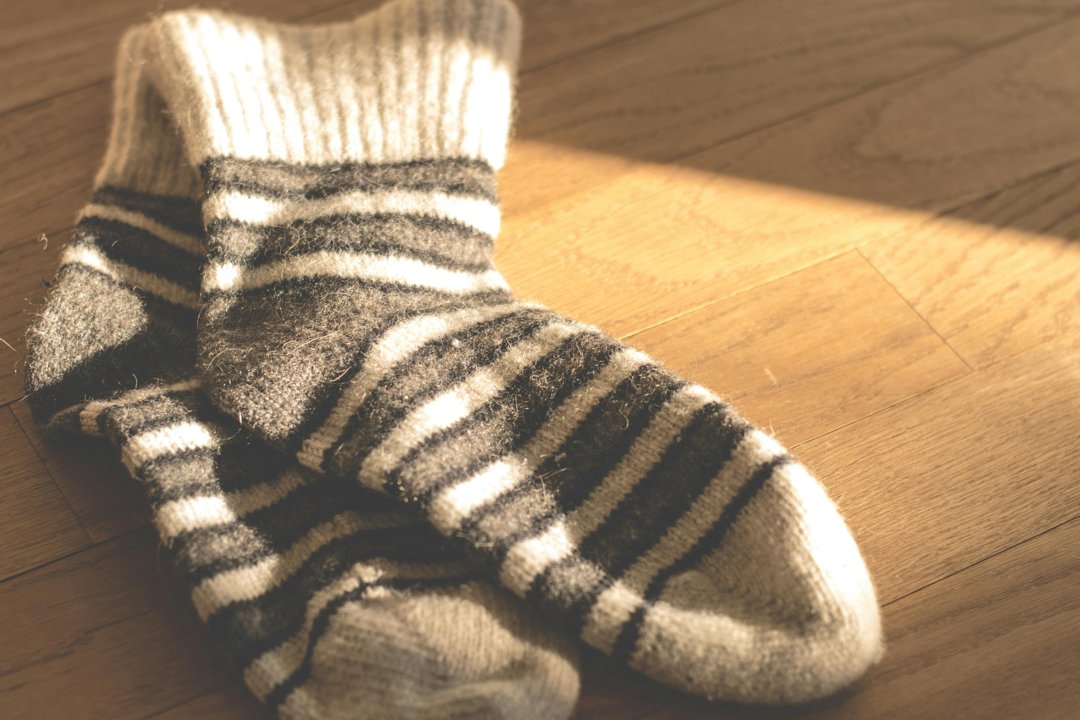 Fuzzy socks on a table | Source: Pexels