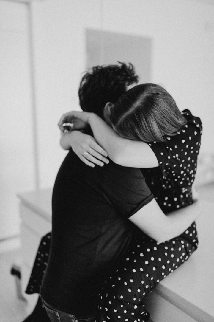 Grayscale shot of a couple hugging each other | Source: Unsplash