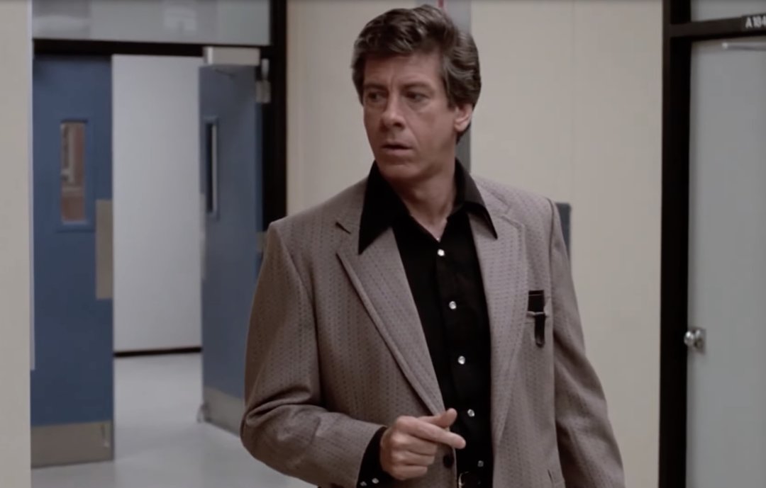 Paul Gleason as principal Richard Vernon in