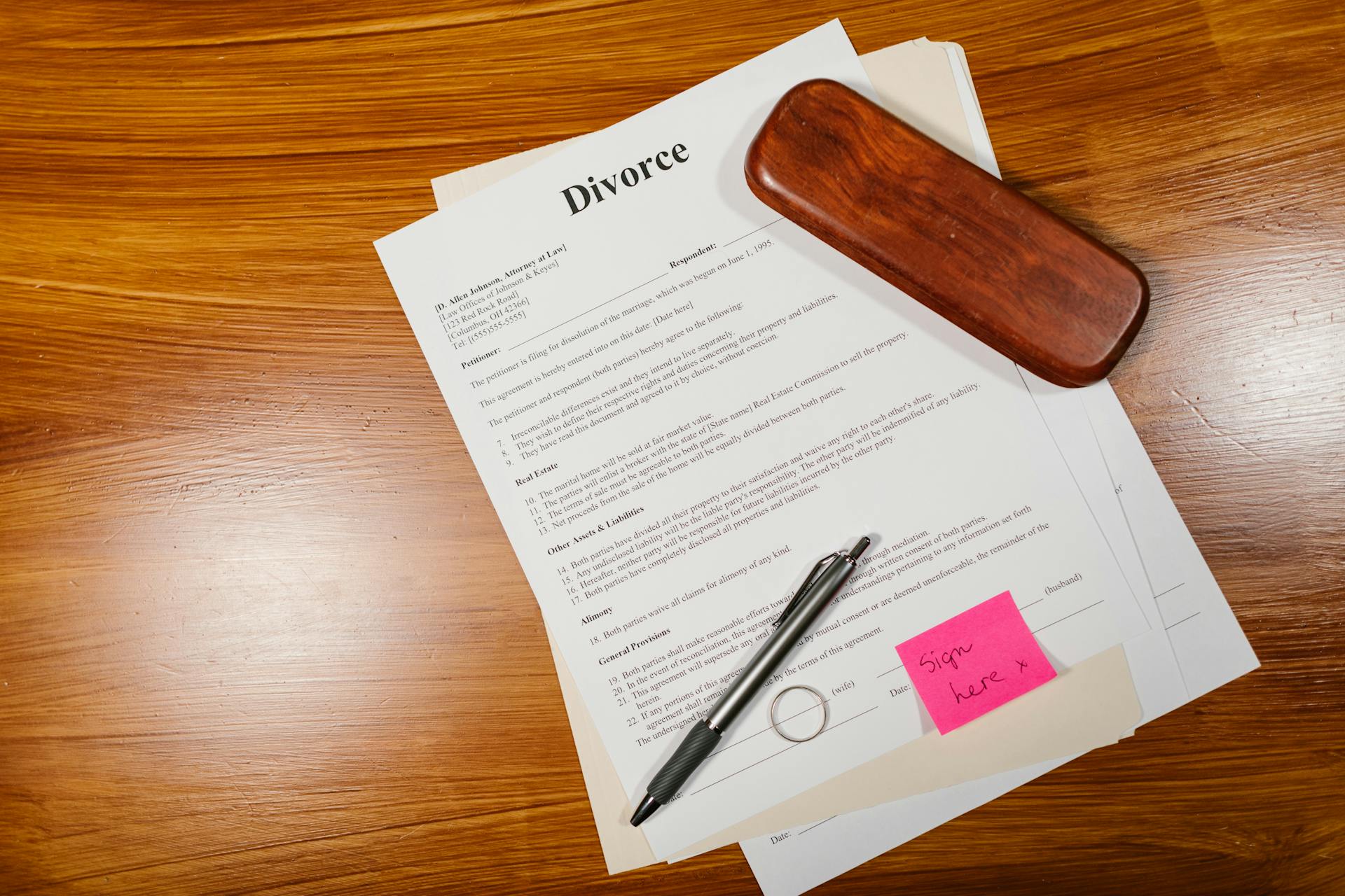 Divorce papers lying on a wooden surface | Source: Pexels