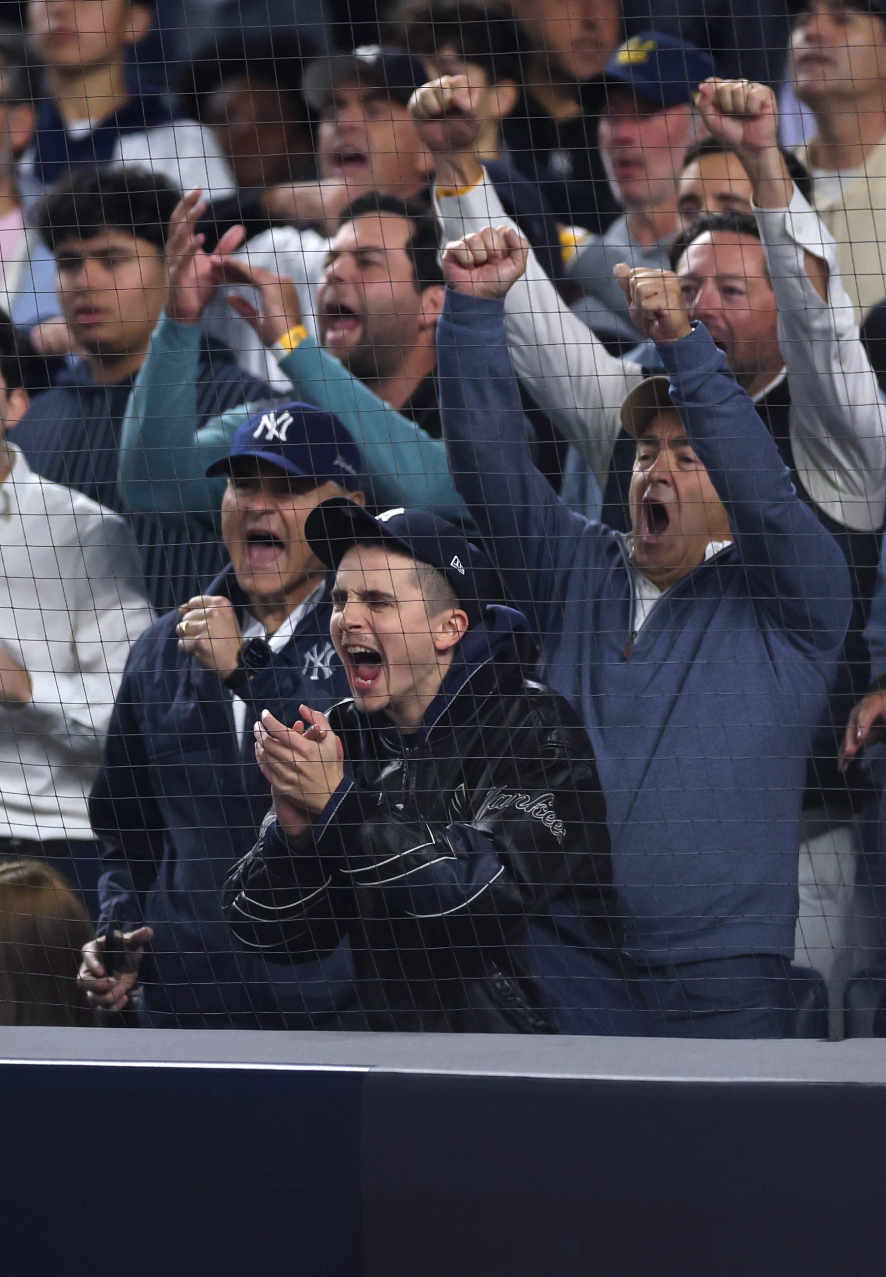 Timothée Chalamet, sporting his new buzz cut, cheered during the fourth inning of Game Four of the American League Division Series between the New York Yankees and the Toronto Blue Jays at Yankee Stadium on October 8, 2025, in New York City.