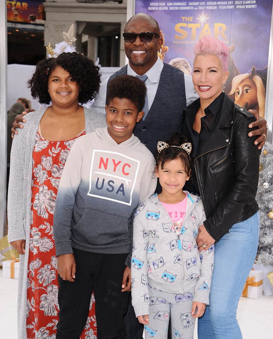 Rebecca and Terry Crews with some of their children and grandchild attend the premiere of