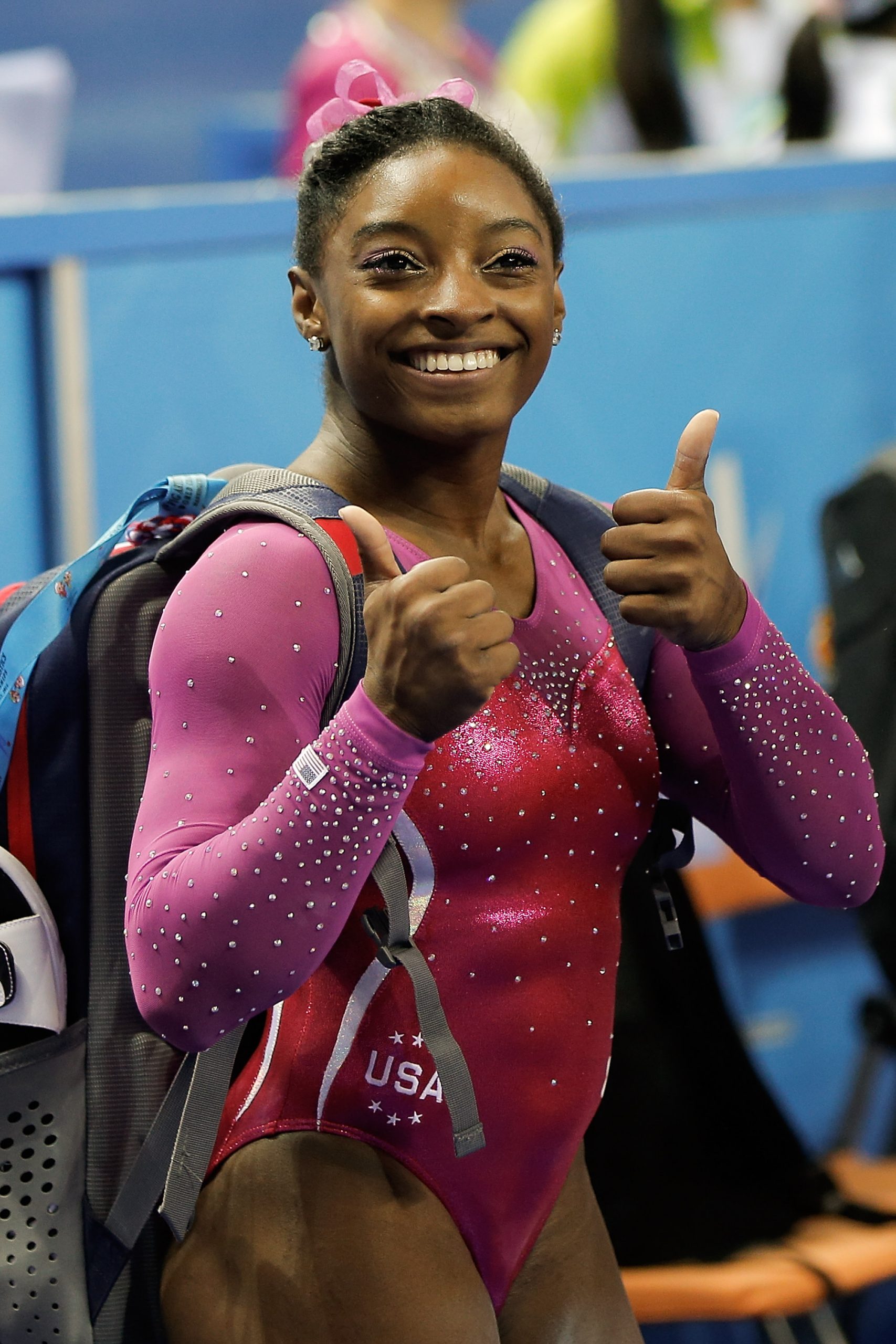Simone Biles celebrates after winning the Women's All-Around Final in day four of the 45th Artistic Gymnastics World Championships on October 10, 2014 | Source: Getty Images