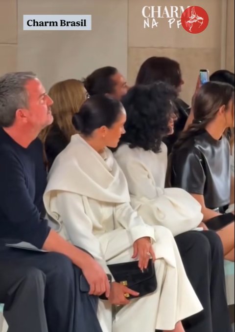Meghan Markle and other attendees watch something, from a video post dated October 7, 2025 | Source: TikTok/TheStandard