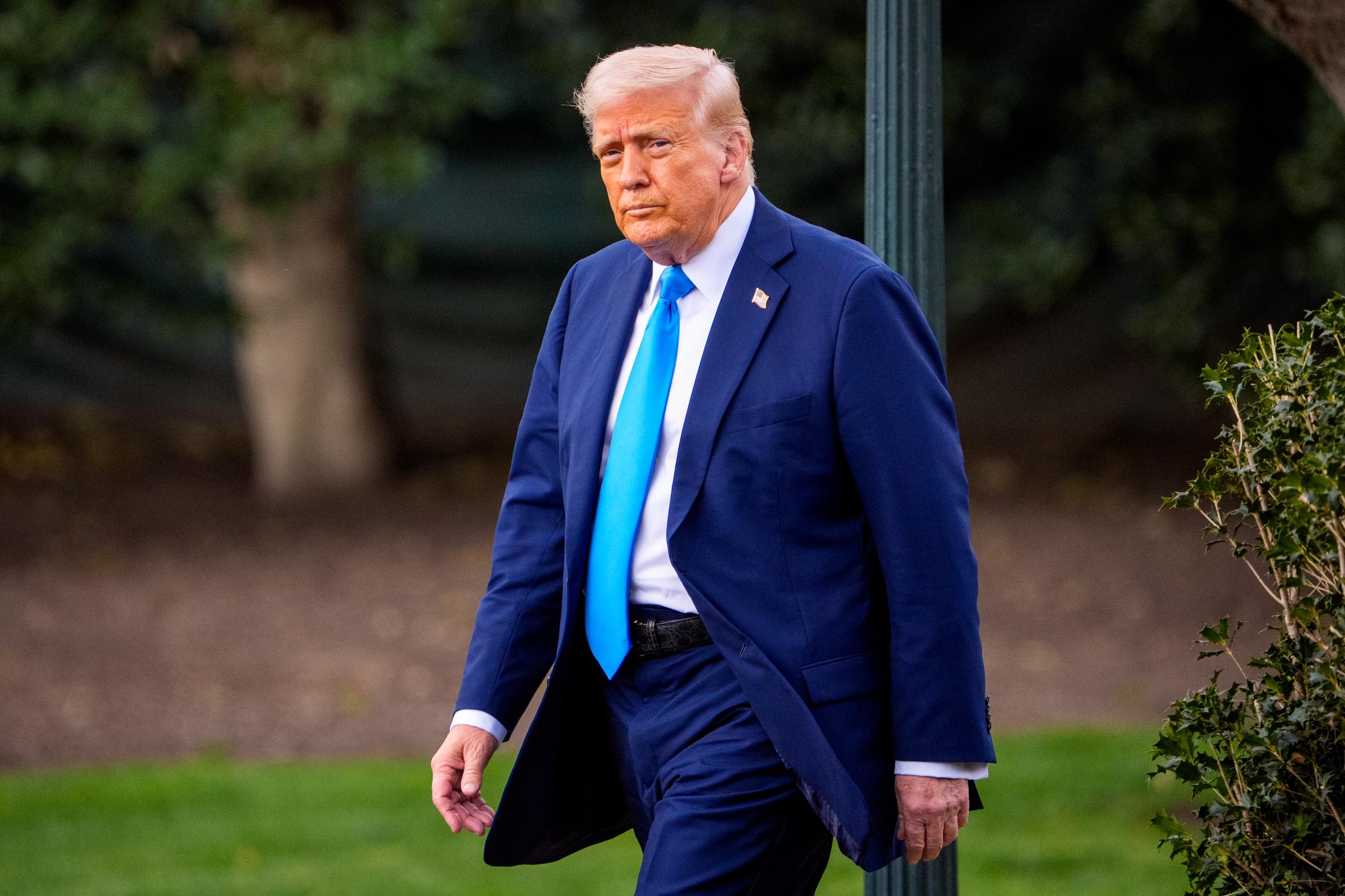 Donald Trump walks towards Marine One on the South Lawn of the White House in Washington, D.C., on March 28, 2025 | Source: Getty Images